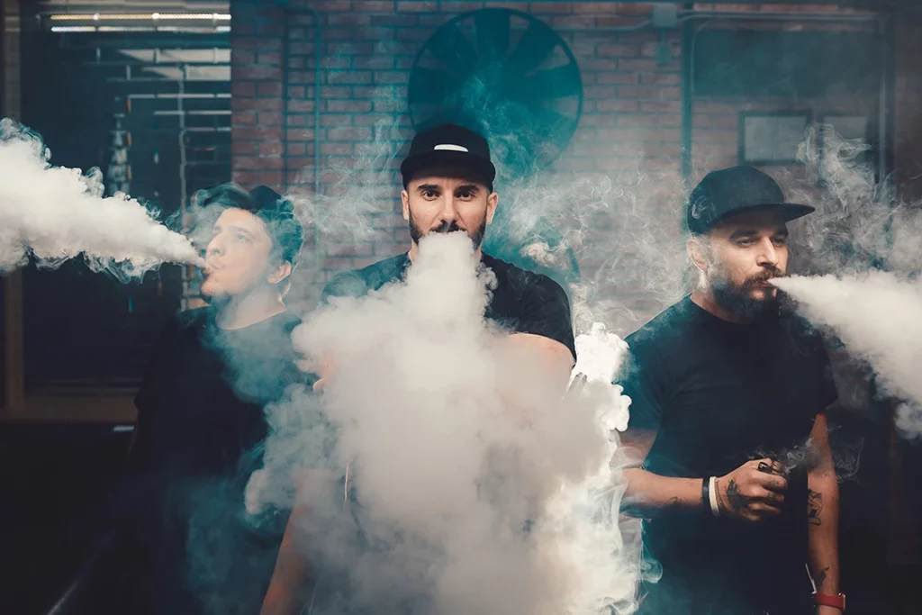 vape store Stevenson - three men exhaling large vapor clouds from their vape devices