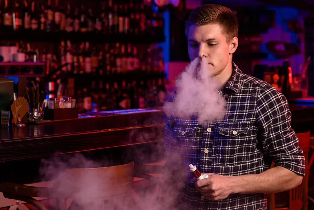 Man vaping in tobacco shop Highland Park