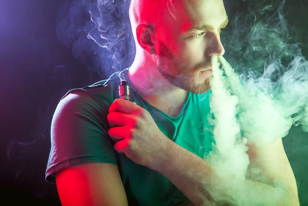 dramatic vape clouds from a bearded man - visit smoke shop Glenhaven