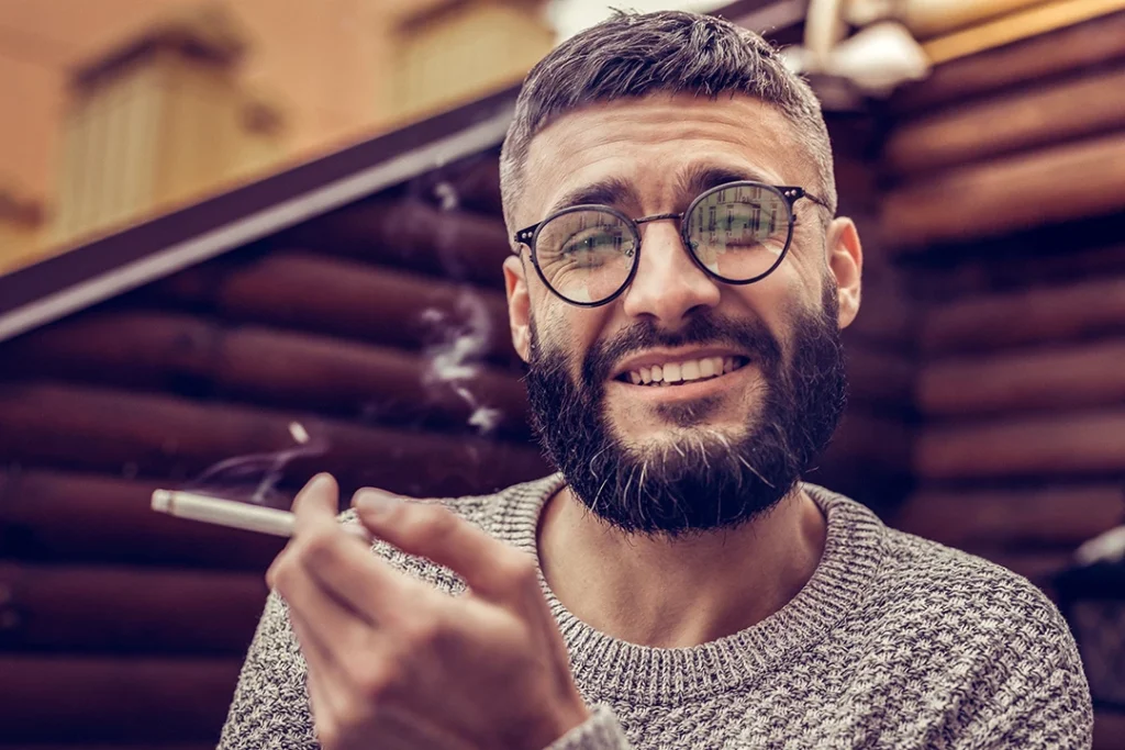 bearded man glasses holding cigarette Mingo Valley