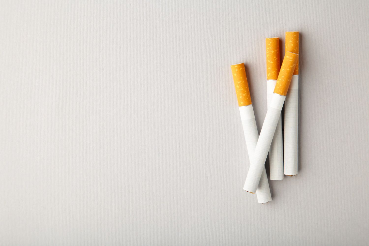 Group of cigarettes arranged on a neutral background, showcasing tobacco products available at a cigarette shop in Houston.