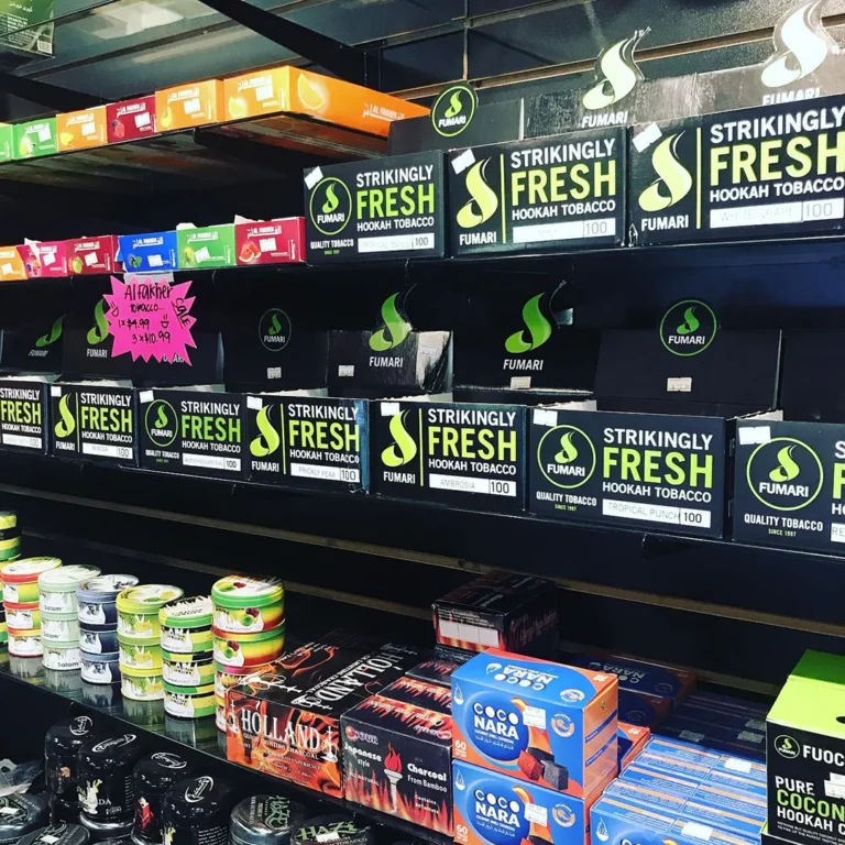 vibrant tobacco shop with shelves of vape devices, e-liquids, and tobacco from Puff, Njoy, and more. A glass case displays accessories, offering a neat layout for smoking alternatives.