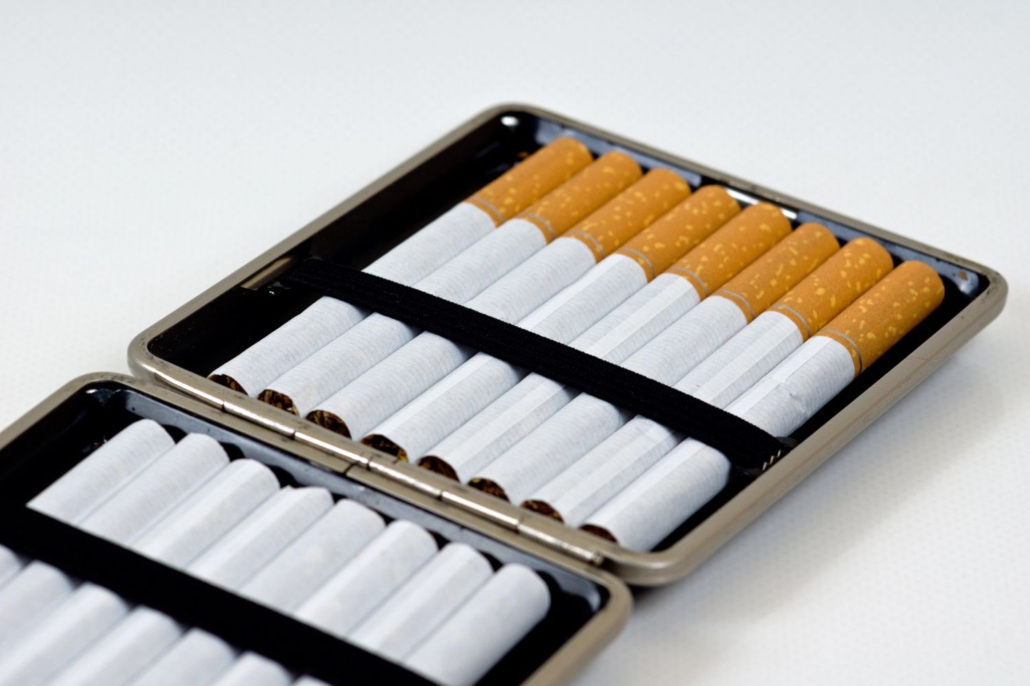 An open cigarette case with neatly arranged cigarettes, perfect for a cigarette shop Broken Arrow.