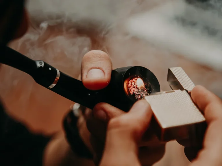 Close-up of colorful glass pipes on display at a glass pipes Houston shop with a vibrant background.