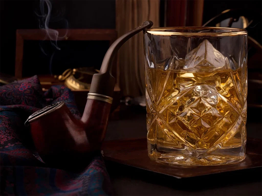 Artisan crafting a glass pipe at a glass pipes Houston workshop with colorful molten glass.