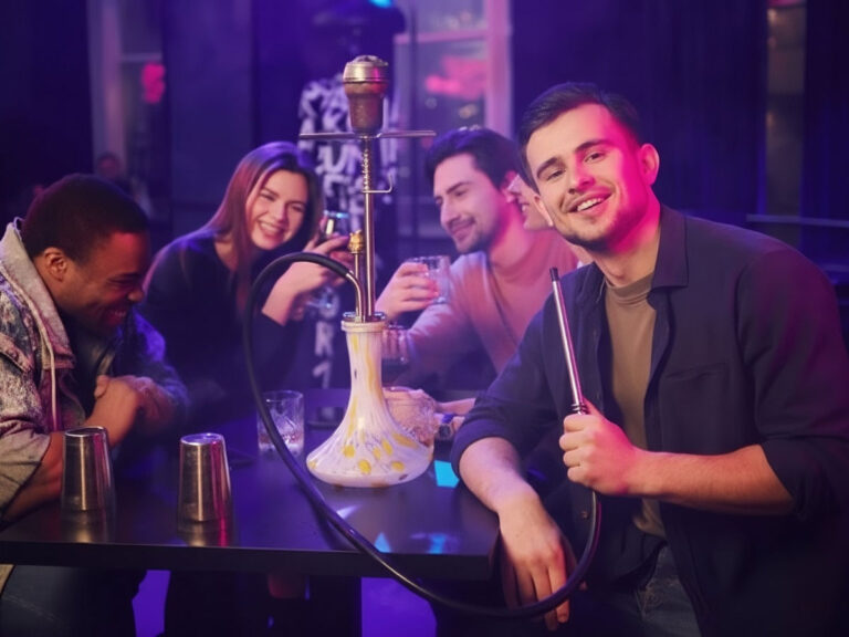 Group of friends enjoying a fun night out at a vibrant hookah shop in Tulsa, sharing smiles and premium hookah sessions with drinks.