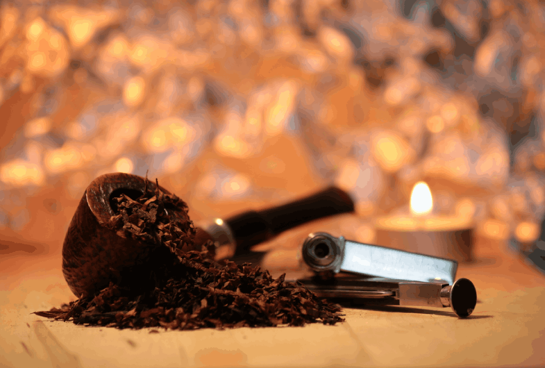 Handcrafted pipe with premium tobacco blend and matches—classic smoking tools from Tobacco Store Sapulpa.
