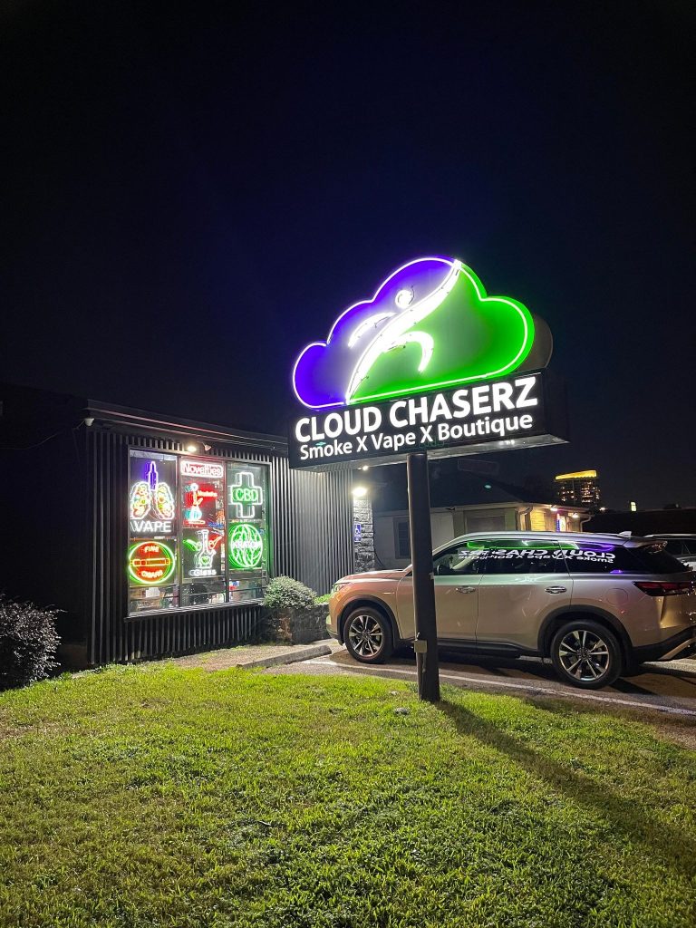 Cloud Chaserz neon sign glowing outside Tulsa’s favorite smoke shop