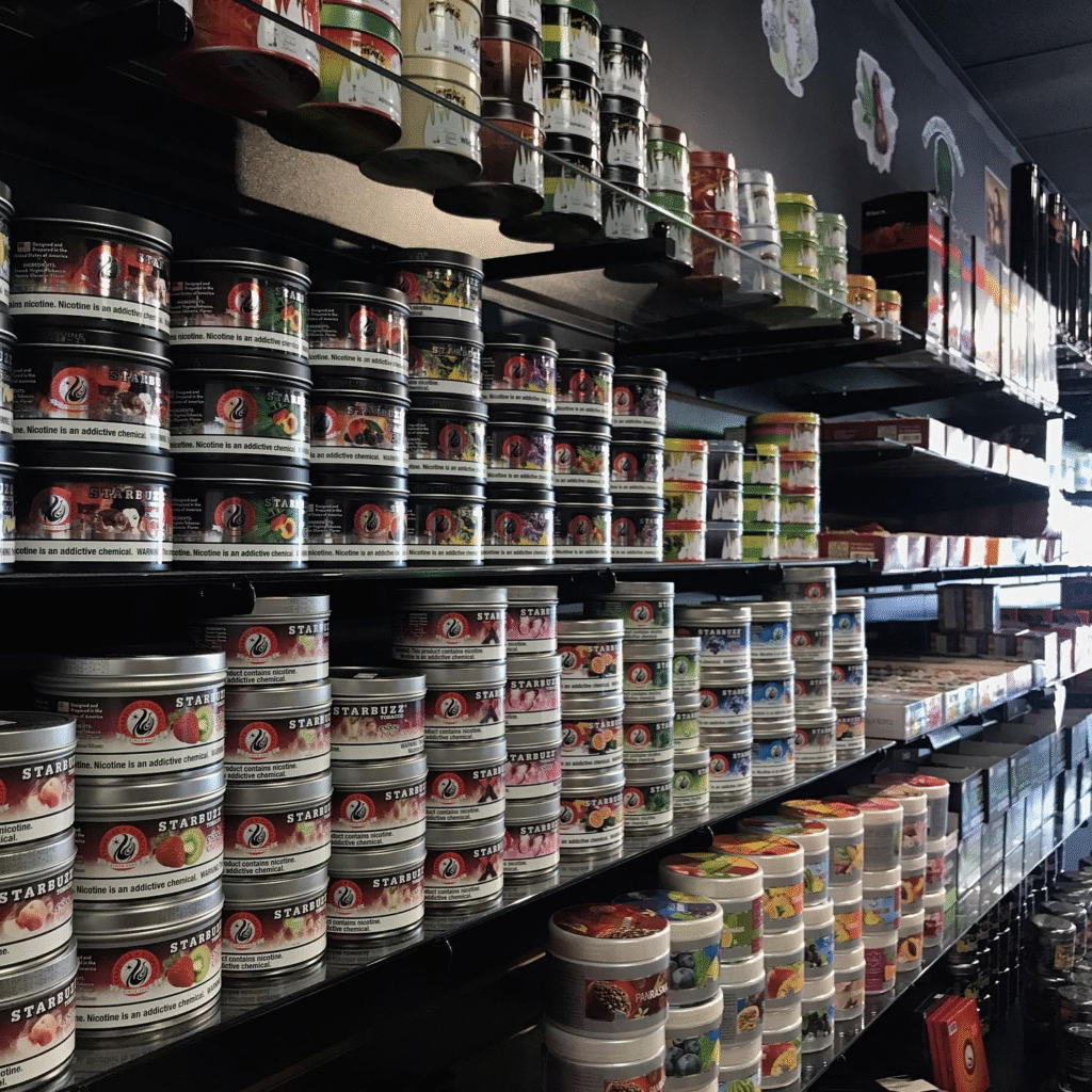 Wall of Starbuzz shisha tobacco tins every flavor available at smoking paraphernalia Tulsa