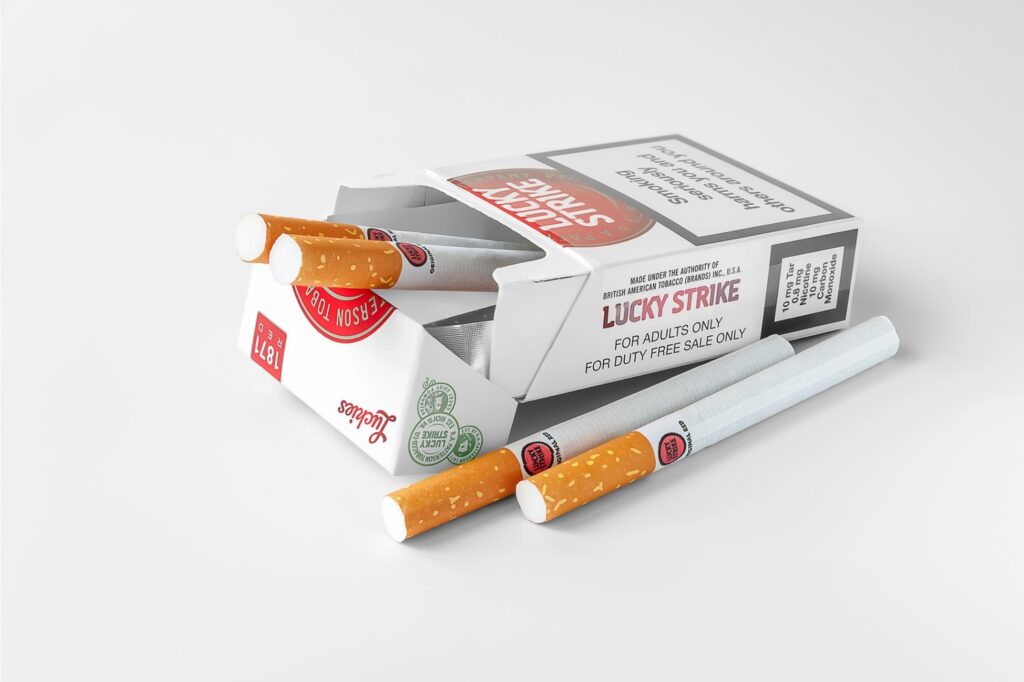 Lucky Strike pack with loose cigarettes—shop classic tobacco brands at the top-rated cigarette shop in Tulsa.