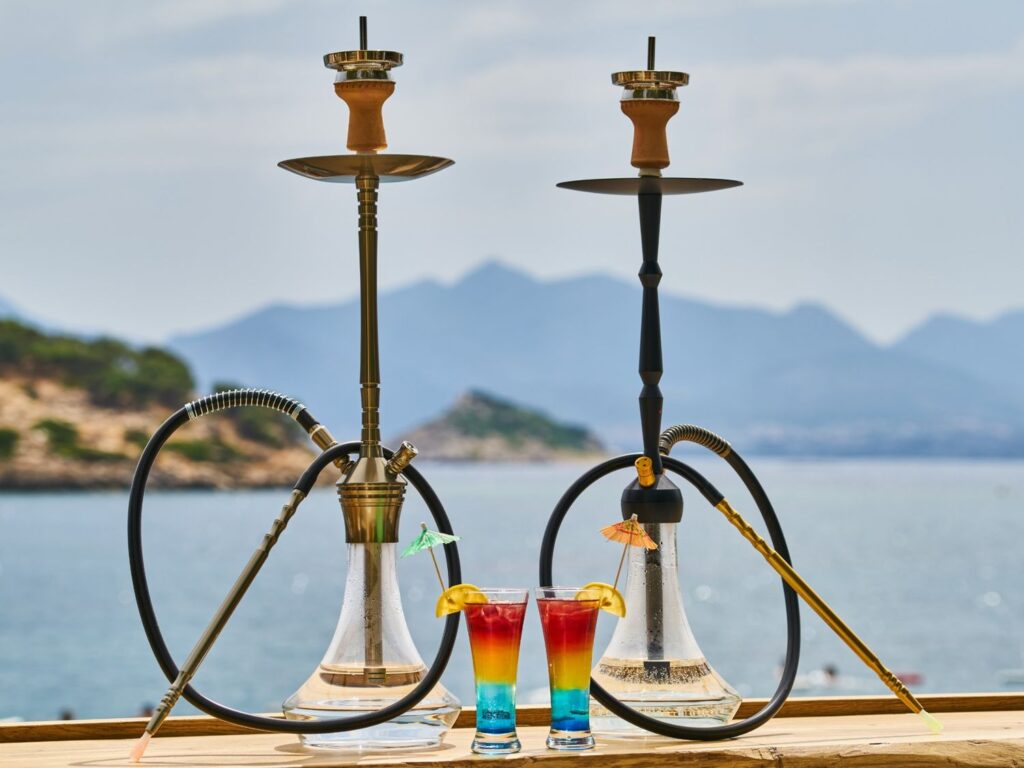 Elegant hookahs by the seaside at Smoke Shop Tulsa, offering premium smoking products with a scenic outdoor vibe for enthusiasts locally.