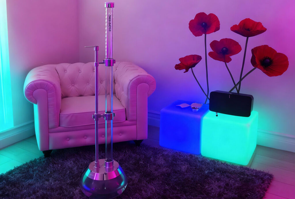 Tall modern gravity bong in neon-lit lounge area at Smoke Store Broken Arrow.