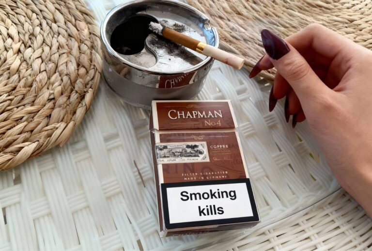 Chapman No.4 Coffee cigarette with lit stick in ashtray at Cigarette Shop Broken Arrow, premium flavored smokes.