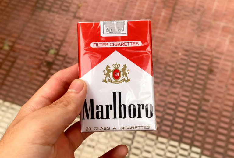 Open and closed pack of Marlboro Cigarettes Broken Arrow showing filter cigarettes and branding.