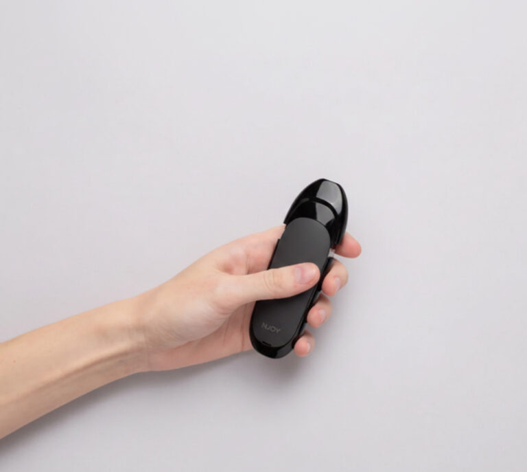 Hand holding a black NJOY pod system, an easy alternative to smoking. Shop for premium Nicotine Pods Tulsa.