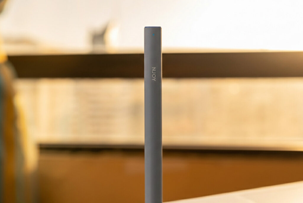 Close-up of a modern, gray NJOY disposable vape pen. Find top-rated Nicotine Pods Tulsa options near you.