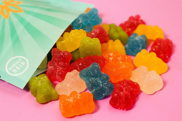 High-strength, sugar-coated CBD gummy bears spilling out of the package. Visit our CBD Store Tulsa for local deals.