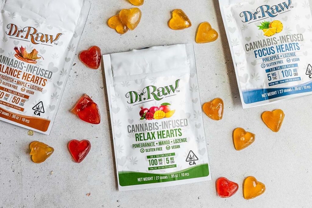 Heart-shaped cannabis-infused gummies and three sealed packages. High-quality CBD products at every CBD Store Tulsa location.