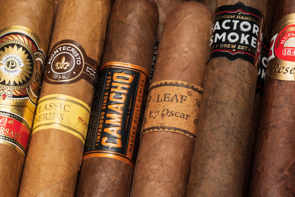 Premium hand-rolled cigars including Montecristo, Camacho, and Leaf by Oscar displayed at a top cigar shop in Sapulpa for enthusiasts.