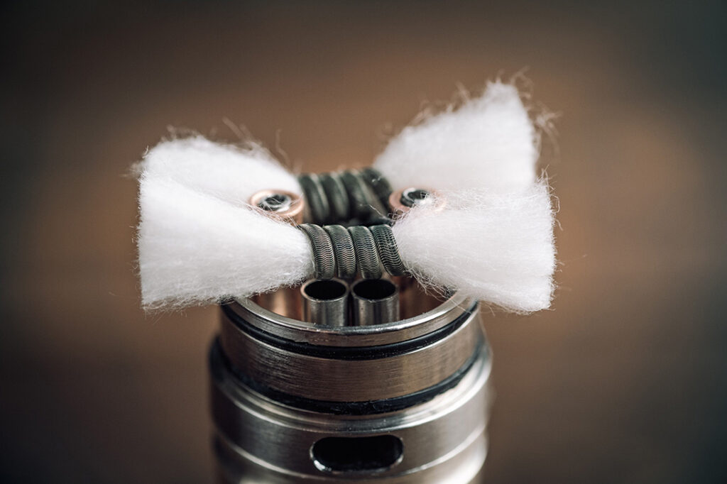 A close up of a dual rebuildable vape coil with cotton wicking, part of the expert Vape Supplies Tulsa collection. 