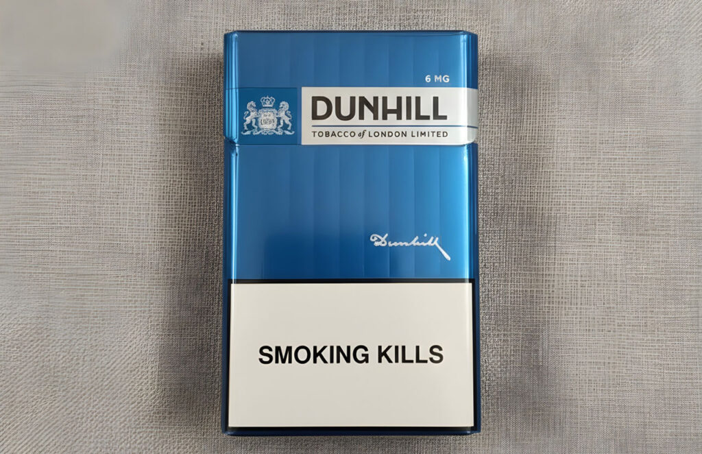 A blue Dunhill 6mg cigarette pack featuring a smoking kills warning label from a cigarette shop Tulsa retailer.