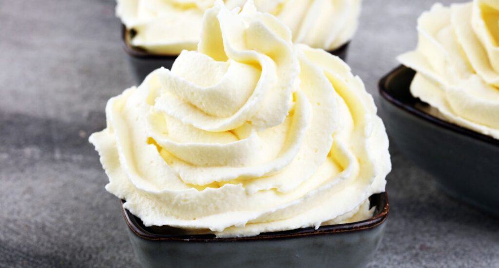 Fresh peaks of fluffy dessert topping made using professional Whip Cream Chargers Owasso for a perfect velvety texture.
