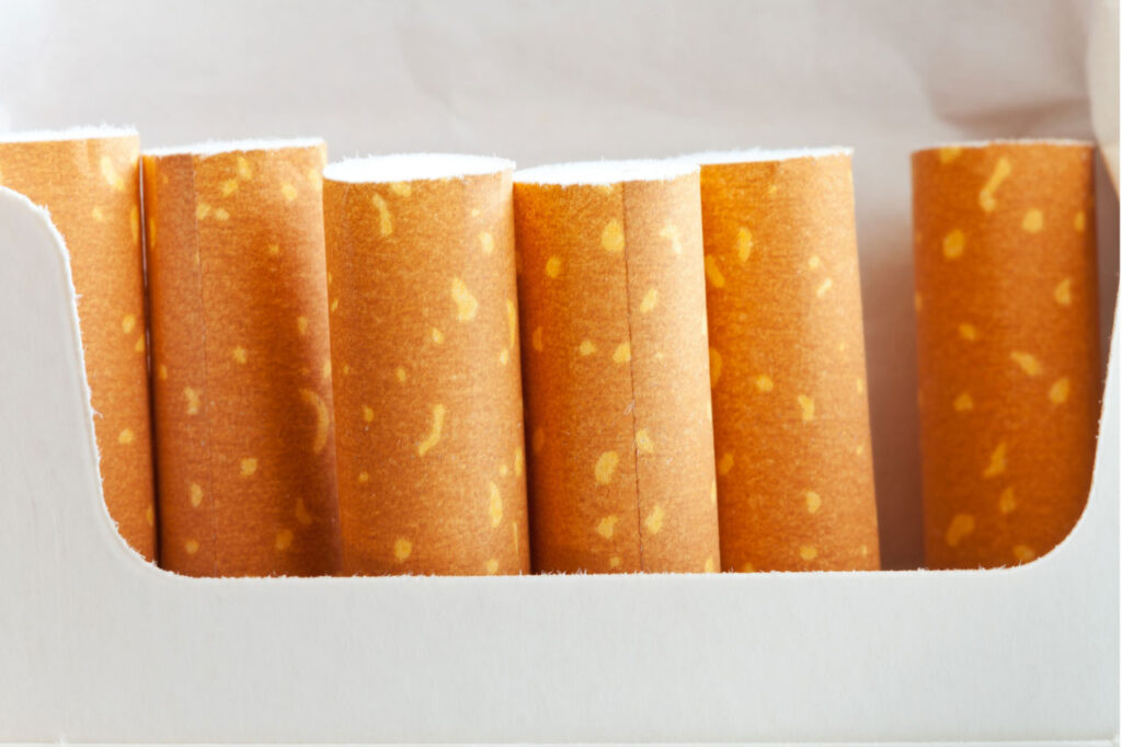 Close up of high quality orange cigarette filters in a white pack available at our cigarette shop Tulsa location.