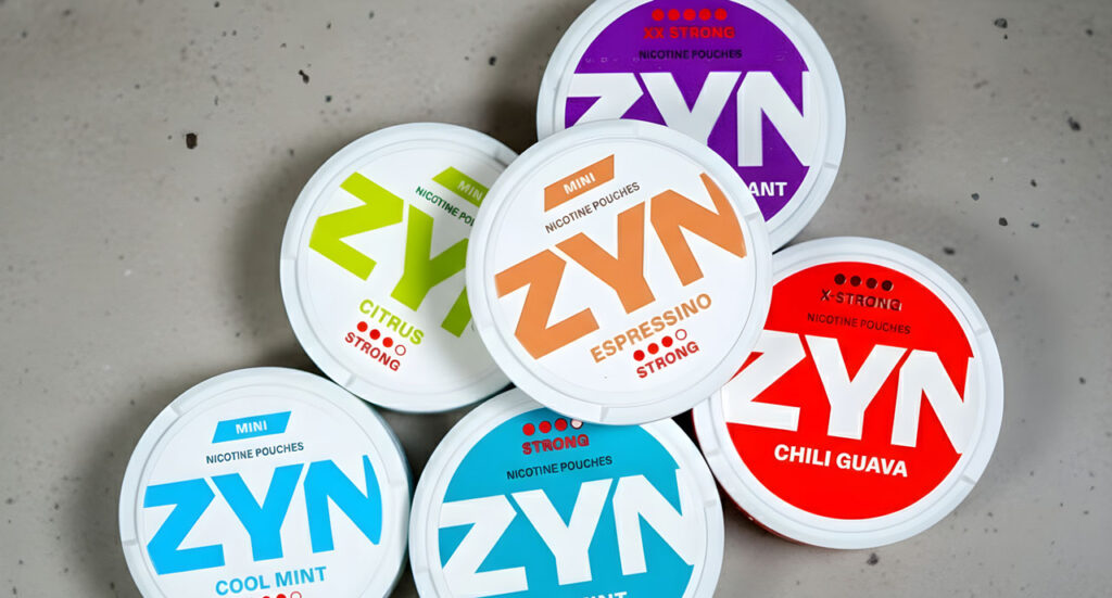 Assorted Zyn nicotine pouches including Chili Guava and Espressino flavors from a top-rated tobacco shop Houston.