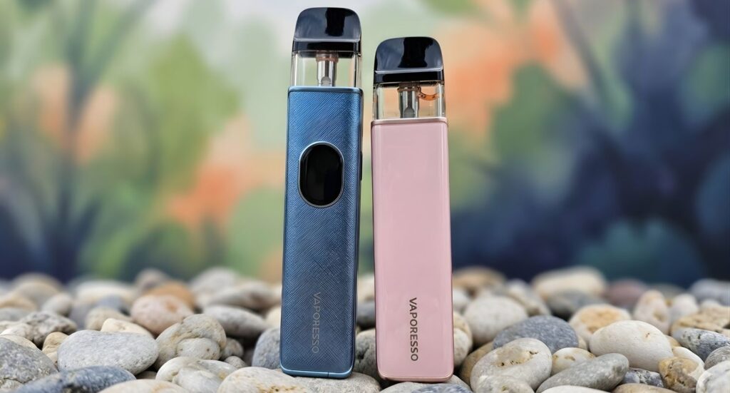 Vaporesso XROS 3 pods in blue and pink on stones, available at your local vape shop Tulsa for a high-end experience.