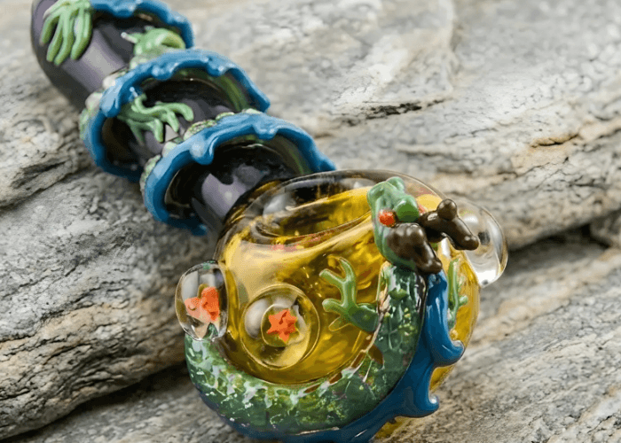 Dragon Ball Z themed Shenron dragon glass pipes Tulsa with blue waves and orange star spheres on a stone background.