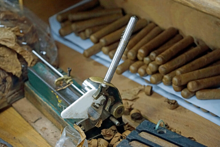 A classic, manual cigar rolling machine used to perfect our artisanal smokes. Visit our authentic cigar shop Sapulpa for quality cigars.