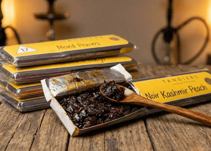 Premium Tangiers Noir Kashmir Peach shisha molasses open with a wooden spoon, sourced from a leading shisha store broken arrow.