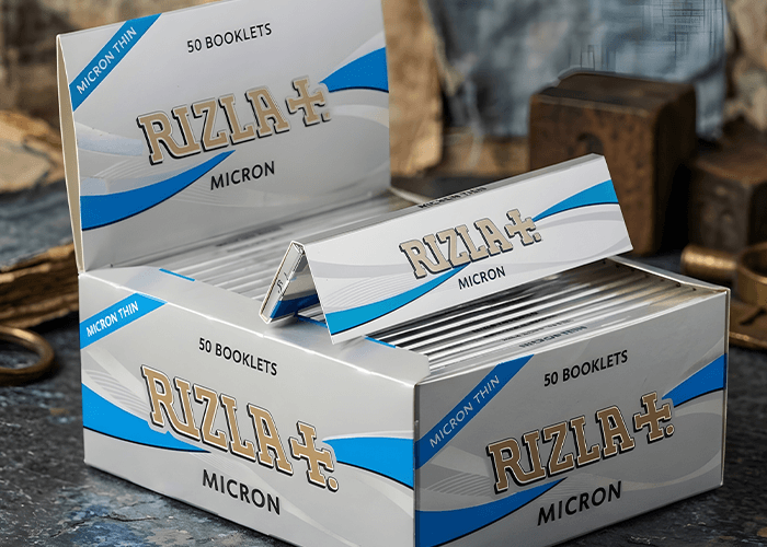 Bulk display box of 50 Rizla Micron thin booklets, wholesale silver and blue rolling papers Tulsa collection.