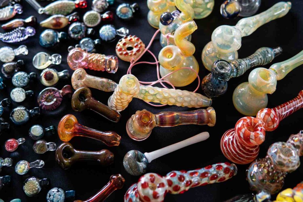 Colorful display of hand blown glass pipes Tulsa head shop collection with unique shapes, patterns, and designs. 