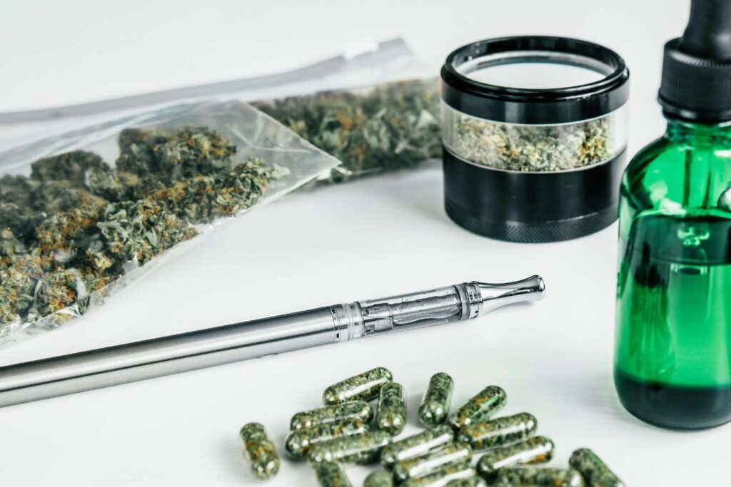 Medical cannabis capsules, tincture, grinder, and pen from a dispensary for herbal vaporizers tulsa.
