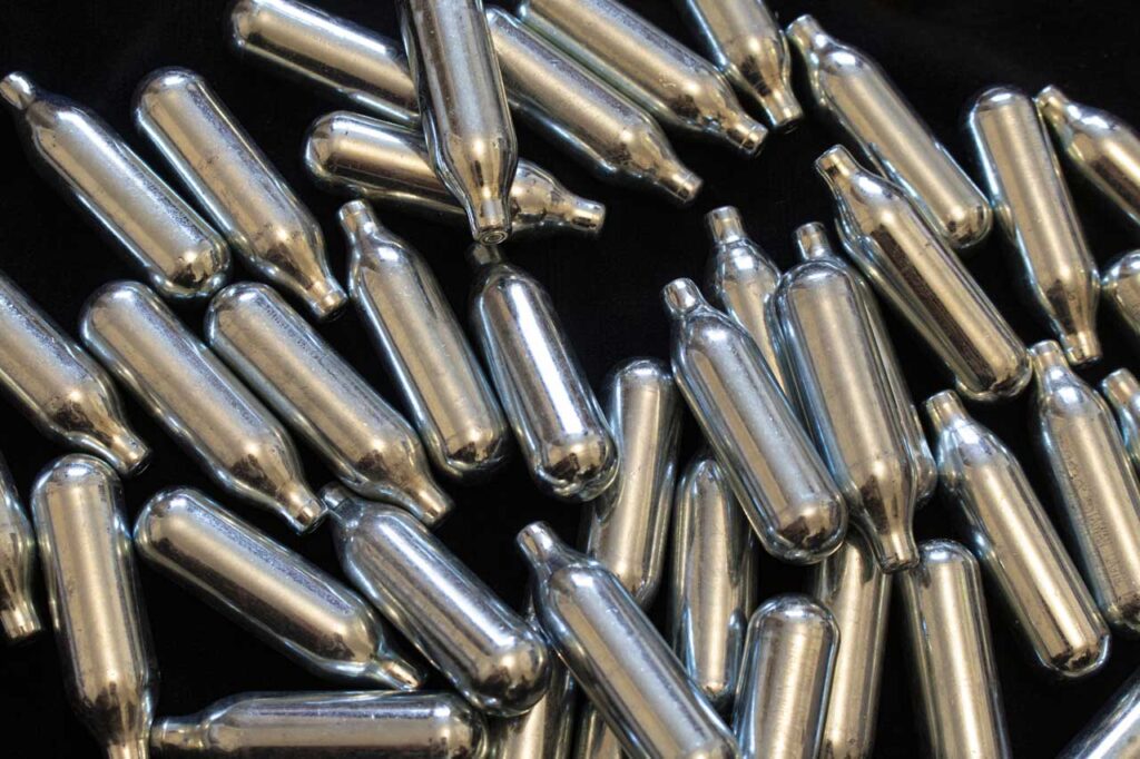 Bulk pile of shiny steel nitrous oxide chargers Tulsa, offering dependable whipping power for local kitchens.