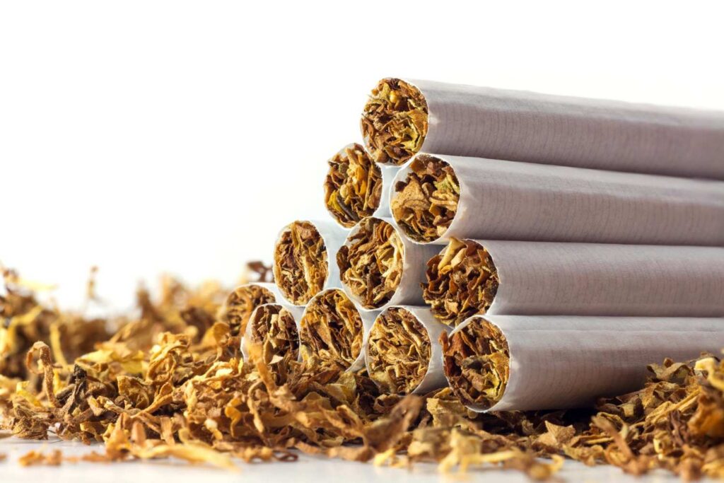 A neat pyramid stack of freshly rolled filter cigarettes, available at our premier tobacco store sapulpa.