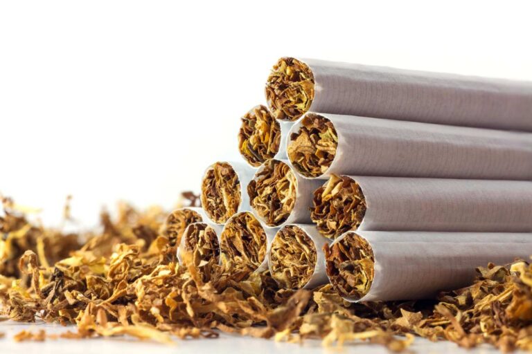 A neat pyramid stack of freshly rolled filter cigarettes, available at our premier tobacco store sapulpa.