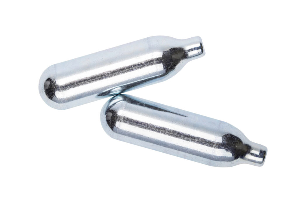 Dual silver nitrous oxide tanks for whipped cream dispensers sold at a leading smoke shop Tulsa