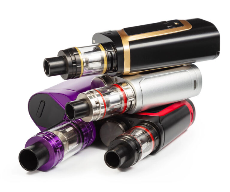 A stacked collection of colorful vape supplies Sapulpa box mods, adjustable tanks, and rebuildable atomizers.