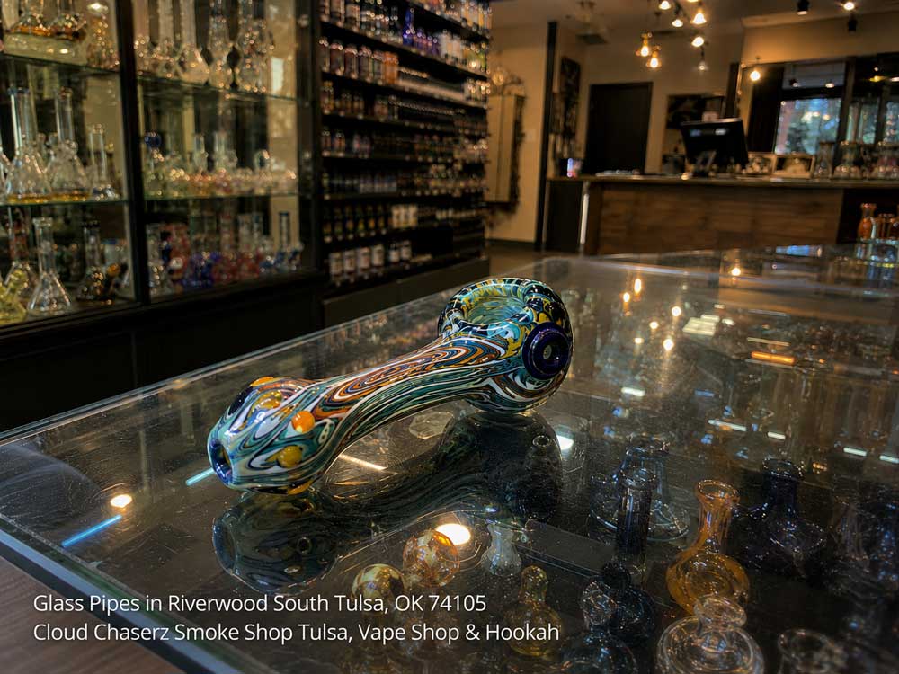 Intricate swirl pattern on one of the premium glass pipes Tulsa vape stores carry, displayed on a glass counter.
