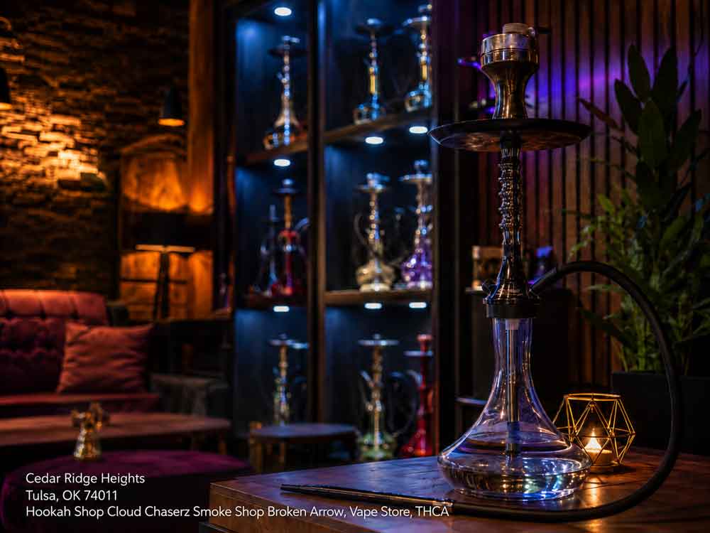 A premium lit glass pipe inside a cozy hookah shop Broken Arrow lounge with warm lighting and display shelves.