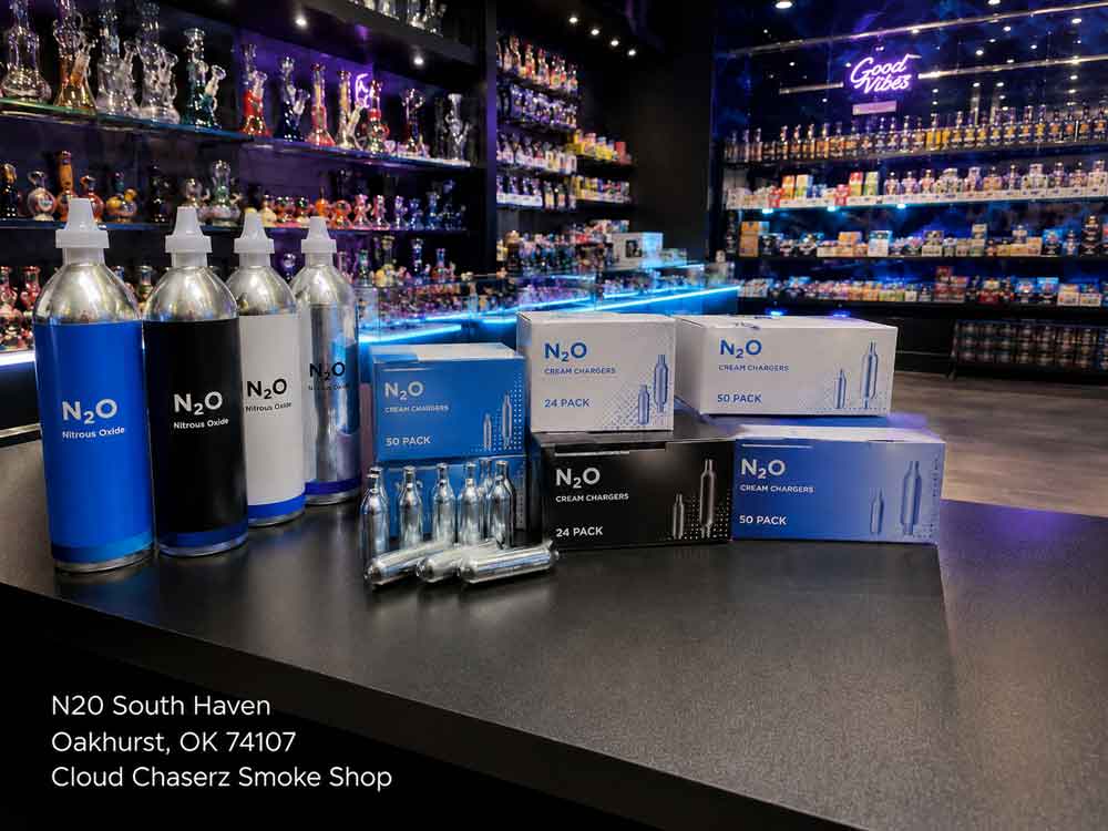 N20 Sapulpa cream chargers and nitrous oxide canisters displayed on a counter at Cloud Chaserz smoke shop.