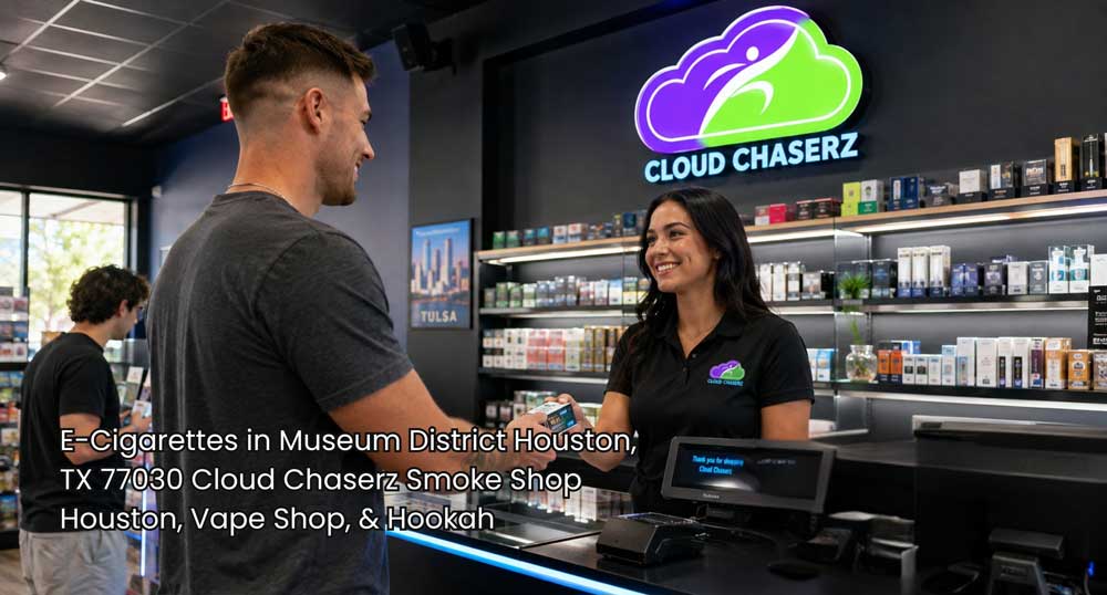 e-cigarettes Houston customer checks out at a Cloud Chaserz counter with organized vape products and store displays.