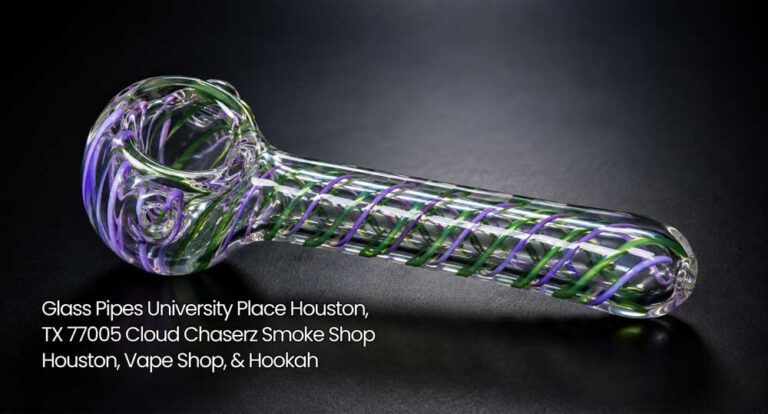 Clear glass pipe with vivid purple and green inner swirls on dark background at Cloud Chaserz glass pipes Houston.