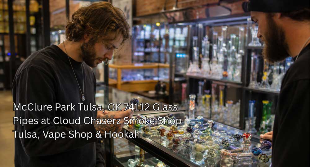 Customer inspecting colorful glass pipes Tulsa selection at Cloud Chaserz Smoke Shop in McClure Park, OK 74112.