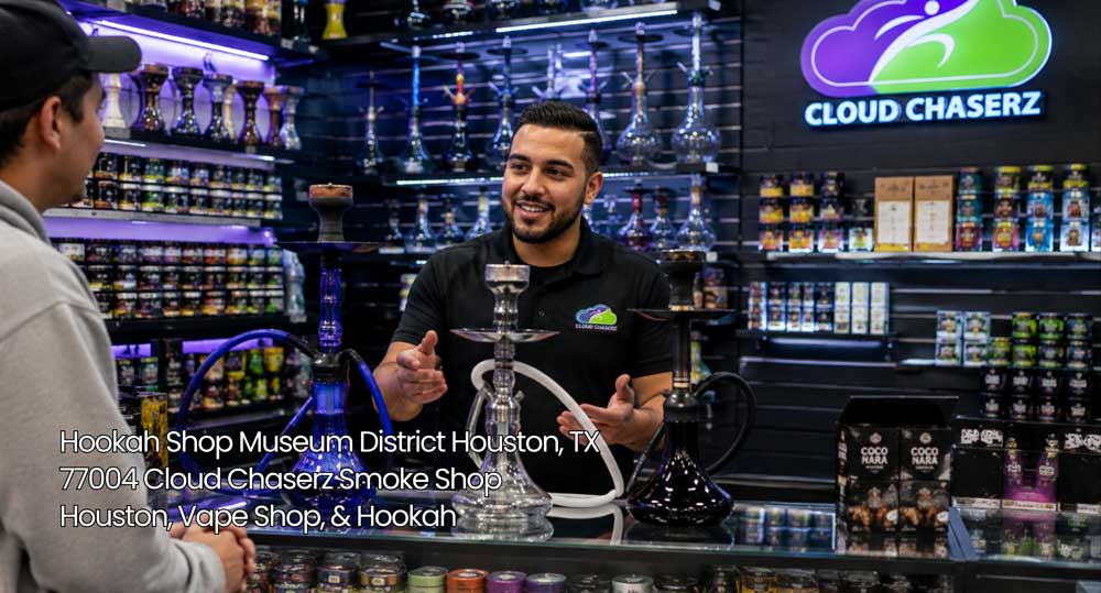 Smiling associate helping a visitor select glass pipes inside a modern hookah shop Houston near the Museum District.