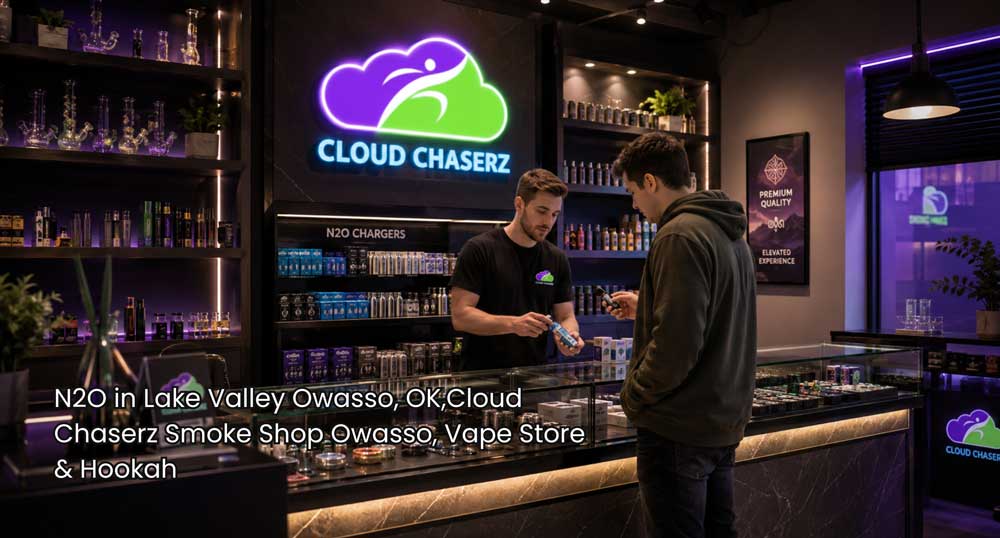 Employee assists a customer with N2O chargers at Cloud Chaserz, showcasing a modern n2O Owasso retail experience.