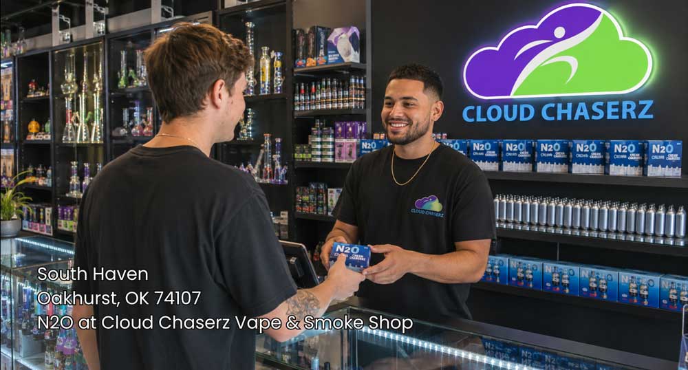 Customer buying cream chargers at a modern Cloud Chaserz smoke shop, featuring n2O Sapulpa products and friendly service.