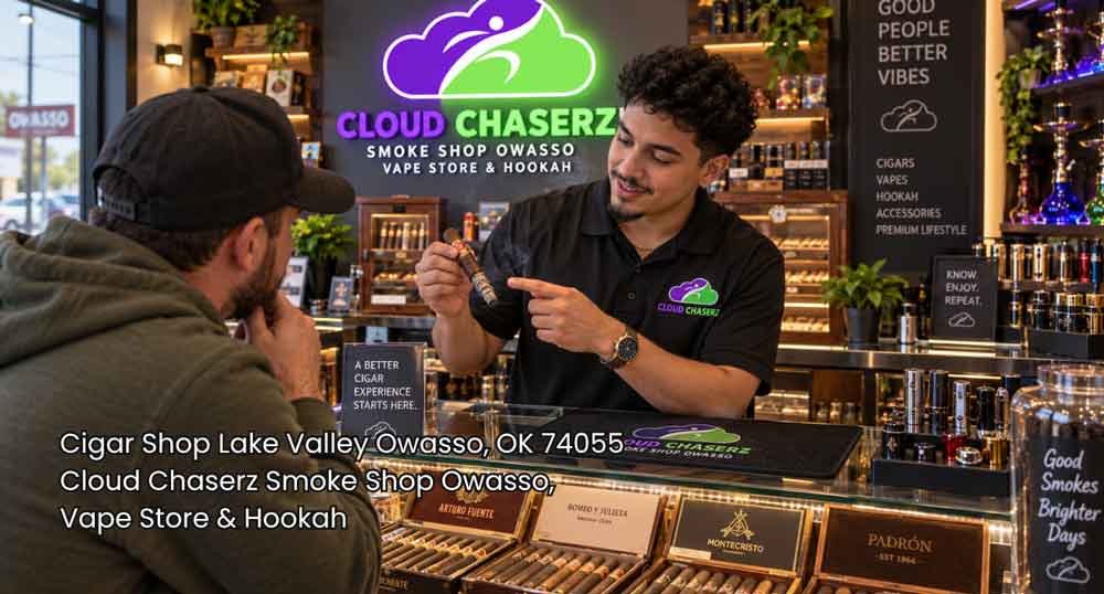 Expert staff assisting a customer at a premium cigar shop Owasso display counter with luxury cigars.